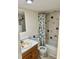 Clean bathroom with a shower/tub combo and tile flooring at 721 S Beach St # 214A, Daytona Beach, FL 32114