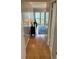 Light and bright hallway with wood flooring at 721 S Beach St # 214A, Daytona Beach, FL 32114