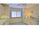 Kitchen features white cabinets, teal countertops, and built-in storage at 11 Andrea Dr, New Smyrna Beach, FL 32168