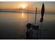 Sunrise on the beach with fishing cart and umbrella at 11 Andrea Dr, New Smyrna Beach, FL 32168