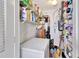 Storage room with shelving for various cleaning supplies and tools at 731 Marina Point Dr # 7310, Daytona Beach, FL 32114