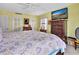 Main bedroom with king-size bed and a dresser at 731 Marina Point Dr # 7310, Daytona Beach, FL 32114