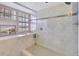 Large walk-in shower with glass enclosure and tile surround at 731 Marina Point Dr # 7310, Daytona Beach, FL 32114