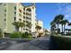 Condominium building with parking and tropical landscaping at 731 Marina Point Dr # 7310, Daytona Beach, FL 32114