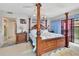 Main bedroom with a king-size bed, dresser, and water views at 731 Marina Point Dr # 7310, Daytona Beach, FL 32114