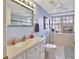 Clean bathroom with a single sink vanity, toilet, and shower/tub combo at 731 Marina Point Dr # 7310, Daytona Beach, FL 32114