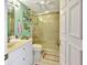 Bathroom with a shower, toilet, and vanity with single sink at 731 Marina Point Dr # 7310, Daytona Beach, FL 32114