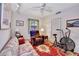 Home office with sofa, exercise bike, and large framed artwork at 731 Marina Point Dr # 7310, Daytona Beach, FL 32114