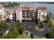 Aerial view of waterfront condo building with parking and water access at 731 Marina Point Dr # 7310, Daytona Beach, FL 32114