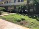 Apartment building with grassy areas and walkways at 400 Oakridge Blvd # 6, Daytona Beach, FL 32118