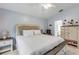 Main bedroom with large bed, dresser, and ensuite bathroom access at 1768 Creekwater Blvd, Port Orange, FL 32128