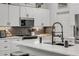 Modern kitchen featuring white cabinets and a large island at 1768 Creekwater Blvd, Port Orange, FL 32128