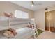 Cozy bunk bed bedroom with playful decor and ample space at 501 S Peninsula Ave, New Smyrna Beach, FL 32169