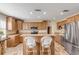 Modern kitchen with wood cabinets, stainless steel appliances, and an island at 501 S Peninsula Ave, New Smyrna Beach, FL 32169