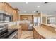 Modern kitchen with stainless steel appliances and light wood cabinets at 501 S Peninsula Ave, New Smyrna Beach, FL 32169