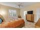 Spacious bedroom with ensuite bathroom access and a dresser at 501 S Peninsula Ave, New Smyrna Beach, FL 32169