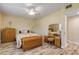 Spacious bedroom with a queen-size bed, dresser, and vanity at 501 S Peninsula Ave, New Smyrna Beach, FL 32169