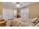 Bedroom with ensuite bathroom and large window with shutters at 501 S Peninsula Ave, New Smyrna Beach, FL 32169