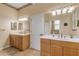 Double vanity bathroom with a separate toilet and access to other rooms at 501 S Peninsula Ave, New Smyrna Beach, FL 32169