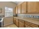 Laundry room with lots of cabinet space and a long countertop at 501 S Peninsula Ave, New Smyrna Beach, FL 32169