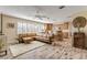 Open concept living area featuring a sectional sofa and kitchen at 501 S Peninsula Ave, New Smyrna Beach, FL 32169
