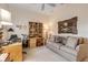 Bright home office with built-in shelving and comfortable seating at 501 S Peninsula Ave, New Smyrna Beach, FL 32169