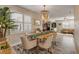 Spacious dining area flows into living room with wood flooring at 501 S Peninsula Ave, New Smyrna Beach, FL 32169