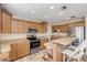 Spacious kitchen with light wood cabinets, stainless steel appliances, and an island at 501 S Peninsula Ave, New Smyrna Beach, FL 32169