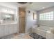 Bathroom with soaking tub, shower, and double vanity at 5452 Saint Regis Way, Port Orange, FL 32128