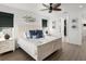 Spacious main bedroom with a king bed, coastal decor, and an ensuite bathroom at 224 Condict Dr, New Smyrna Beach, FL 32169