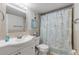 Clean bathroom with shower/tub combo, vanity, and updated fixtures at 3801 S Atlantic Ave # 307, New Smyrna Beach, FL 32169