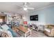 Open concept living area featuring a spacious living room and kitchen at 3801 S Atlantic Ave # 307, New Smyrna Beach, FL 32169