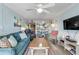 Open concept living area with comfortable seating and TV at 3801 S Atlantic Ave # 307, New Smyrna Beach, FL 32169