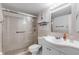 Clean bathroom with walk-in shower and white vanity at 3801 S Atlantic Ave # 307, New Smyrna Beach, FL 32169