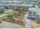 Aerial view of a beach house and vacant lot, near the ocean at 6604 S Atlantic Ave, New Smyrna Beach, FL 32169