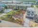 Aerial view of vacant lot, oceanfront, near other homes at 6604 S Atlantic Ave, New Smyrna Beach, FL 32169
