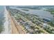 Aerial view of beachfront home and surroundings at 6604 S Atlantic Ave, New Smyrna Beach, FL 32169
