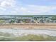 Beachfront property aerial view, showing homes and beach at 6604 S Atlantic Ave, New Smyrna Beach, FL 32169