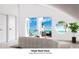 Lounge with access to a balcony and ocean view at 6604 S Atlantic Ave, New Smyrna Beach, FL 32169