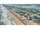 Aerial of beachfront homes and beach at 6604 S Atlantic Ave, New Smyrna Beach, FL 32169