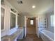 Elegant bathroom with double sinks, garden tub, and separate shower at 689 Eagle Watch Rd, Oak Hill, FL 32759