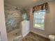 Bathroom with walk-in shower and marble tile at 689 Eagle Watch Rd, Oak Hill, FL 32759