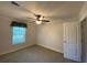 Bright bedroom with ceiling fan and ample closet space at 689 Eagle Watch Rd, Oak Hill, FL 32759