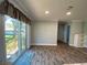Bright dining area with sliding glass doors leading to the backyard at 689 Eagle Watch Rd, Oak Hill, FL 32759