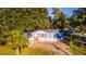 Blue manufactured home with a spacious yard at 689 Eagle Watch Rd, Oak Hill, FL 32759