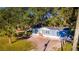 Newly built manufactured home with a large yard and mature trees at 689 Eagle Watch Rd, Oak Hill, FL 32759
