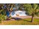 Newly built manufactured home with a large yard and mature trees at 689 Eagle Watch Rd, Oak Hill, FL 32759