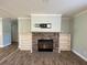 Stone fireplace with built-in shelving in the living room at 689 Eagle Watch Rd, Oak Hill, FL 32759