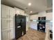 Modern kitchen with white cabinets and stainless steel appliances at 689 Eagle Watch Rd, Oak Hill, FL 32759