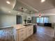 Large kitchen island with double sink and seating space at 689 Eagle Watch Rd, Oak Hill, FL 32759